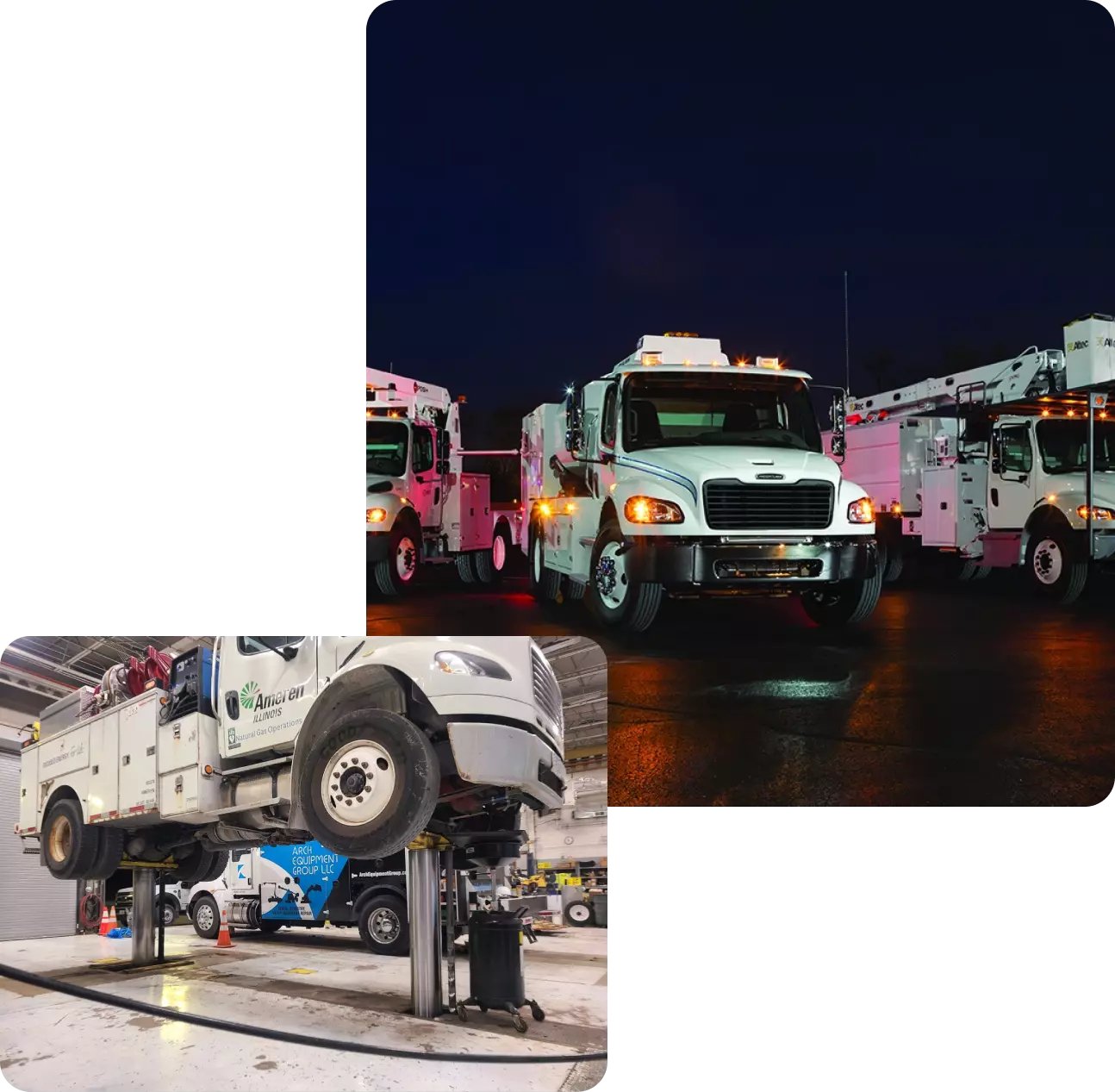 White utility trucks parked at night.